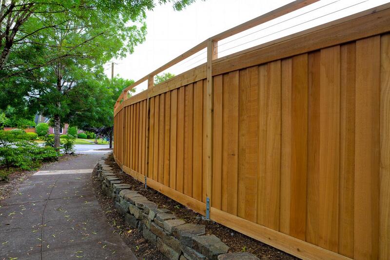 wood fence beside the walkway
