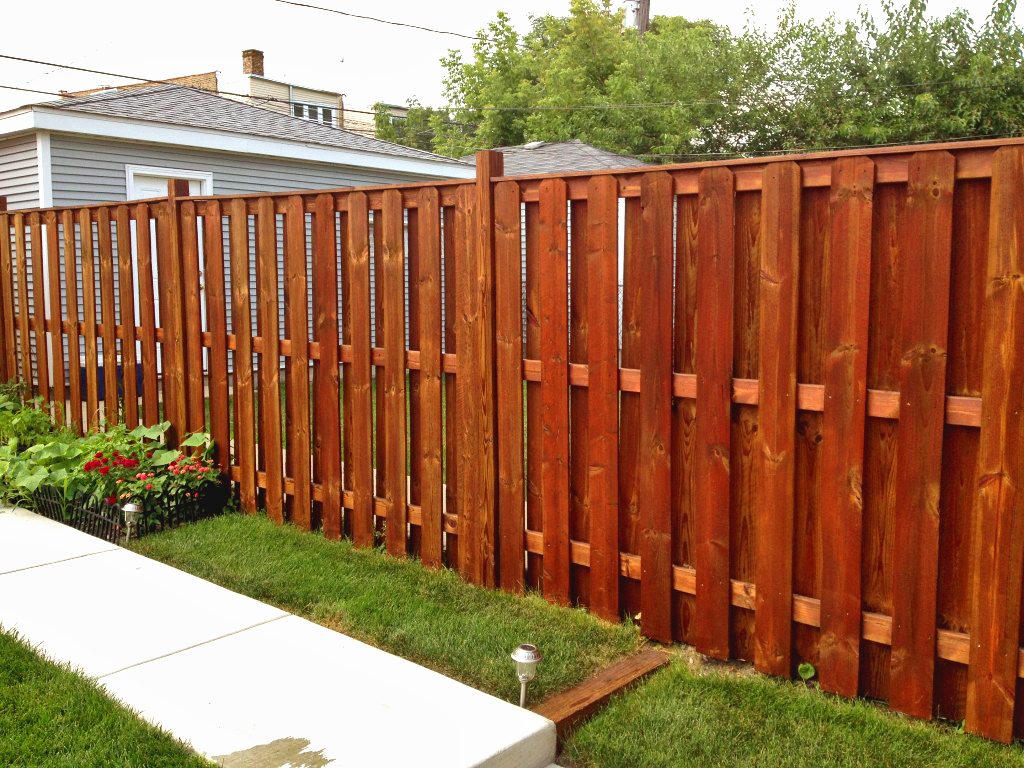 Shadow box fence with redwood stain